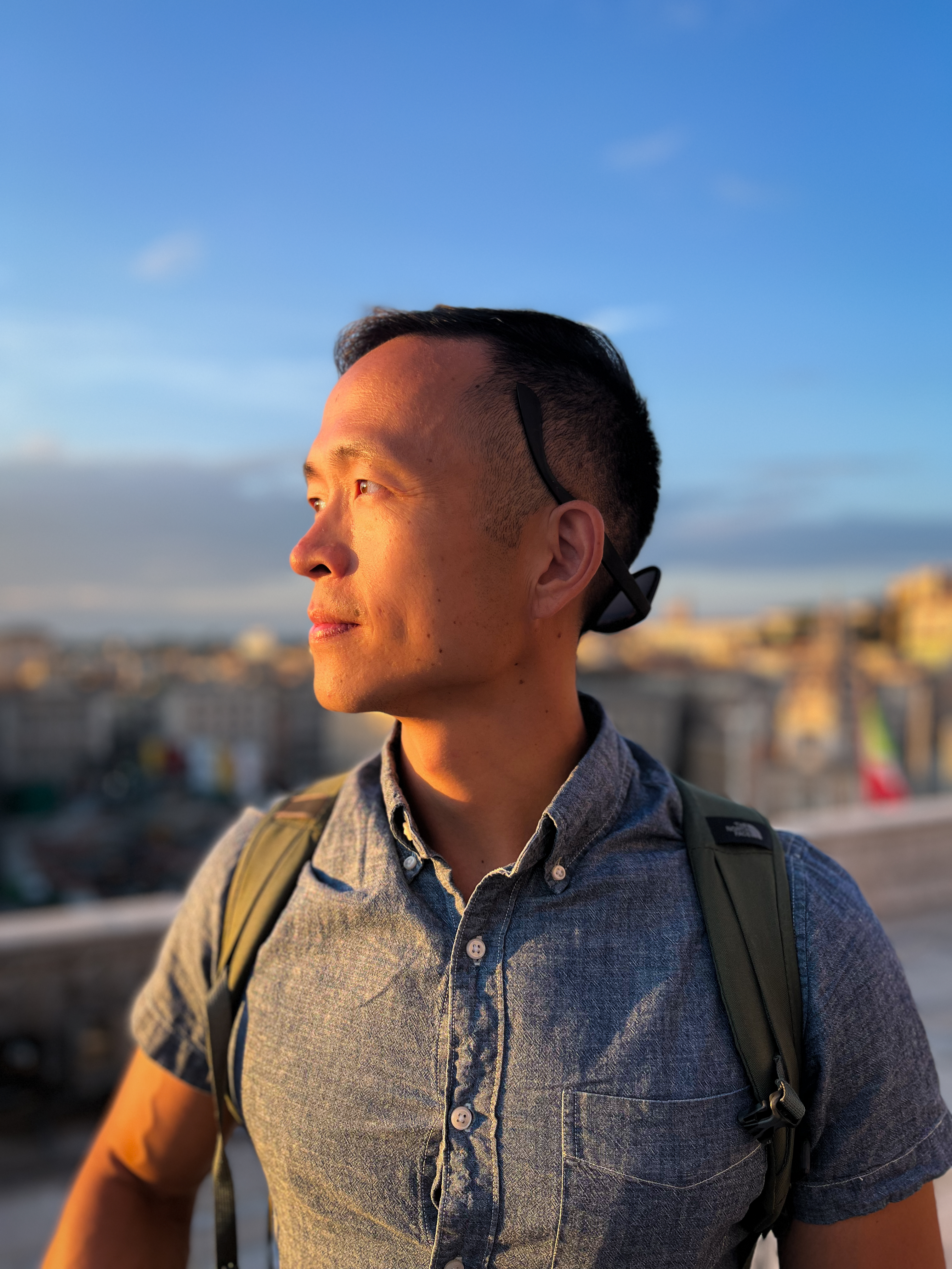 Mason looking toward the sunset at a city overlook