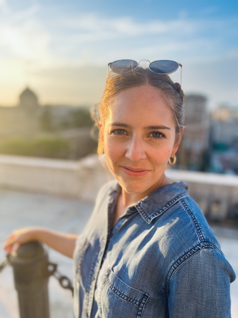 Portrait of a woman in a denim shirt in warm evening light